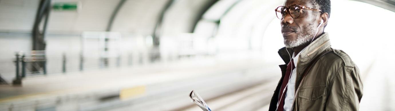 Man on train platform Man on train platform
